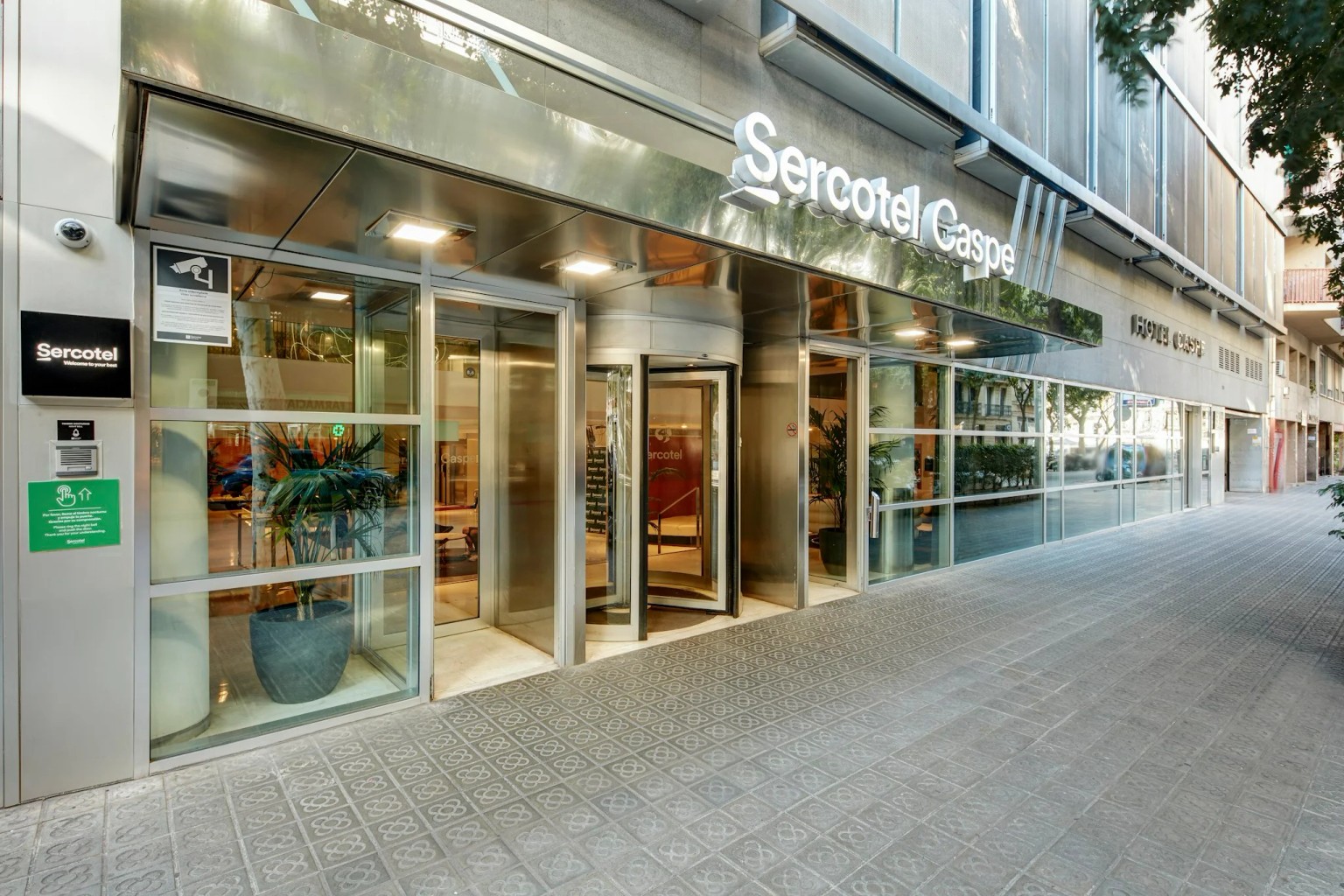 Cinematic hospitality film frame showing the entrance of Sercotel Caspe